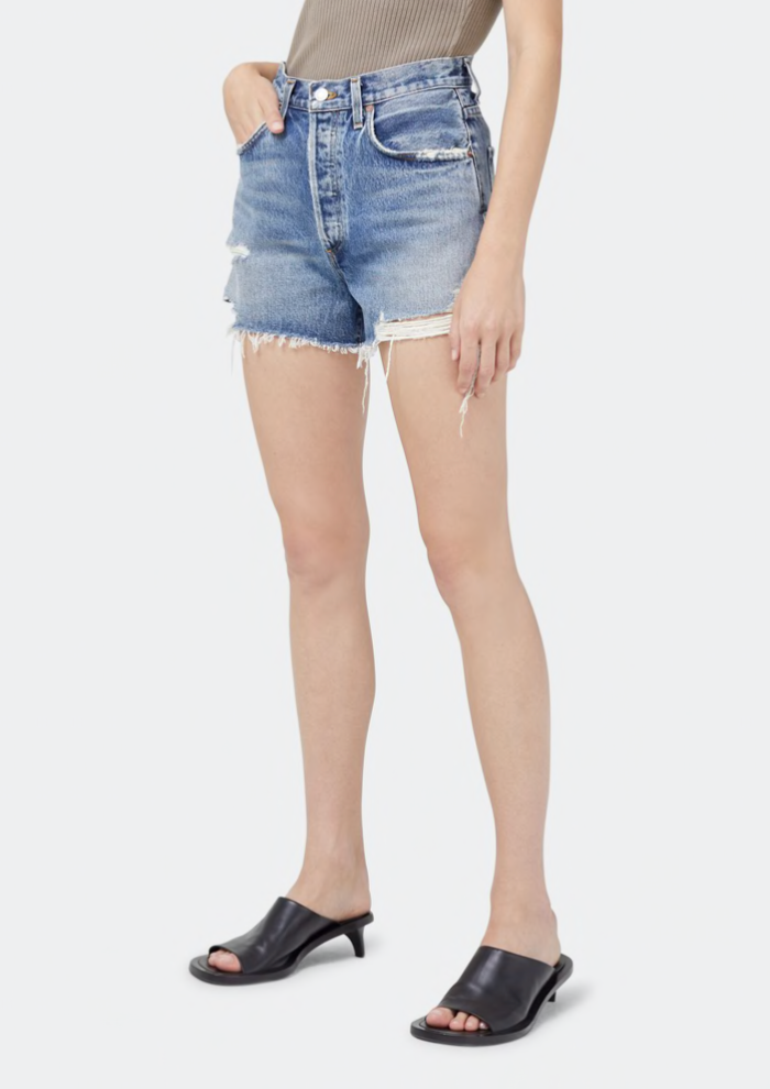 AGOLDE distressed high rise denim shorts in turmoil wash.