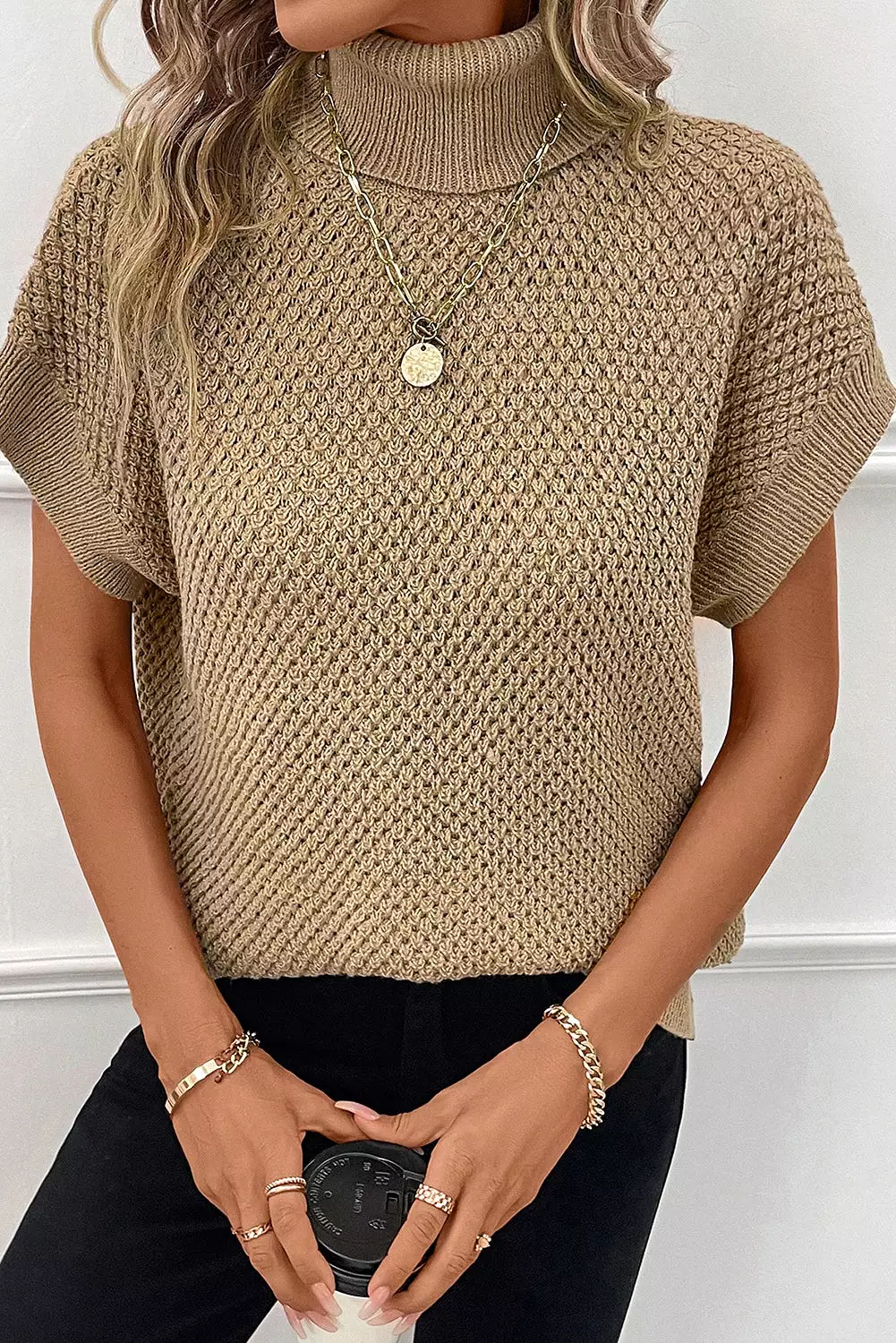 Khaki short sleeve turtleneck sweater.