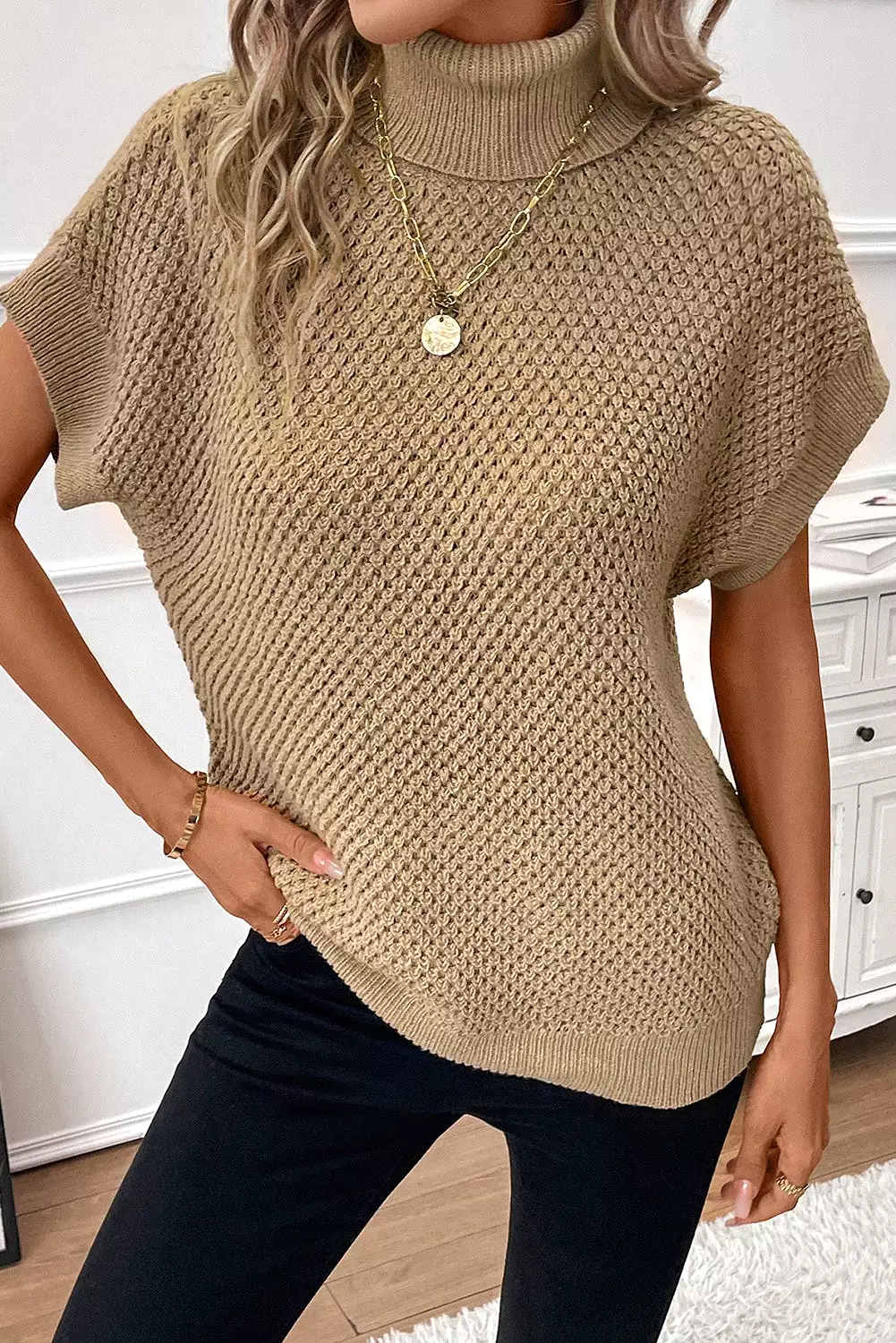 Khaki short sleeve turtleneck sweater.