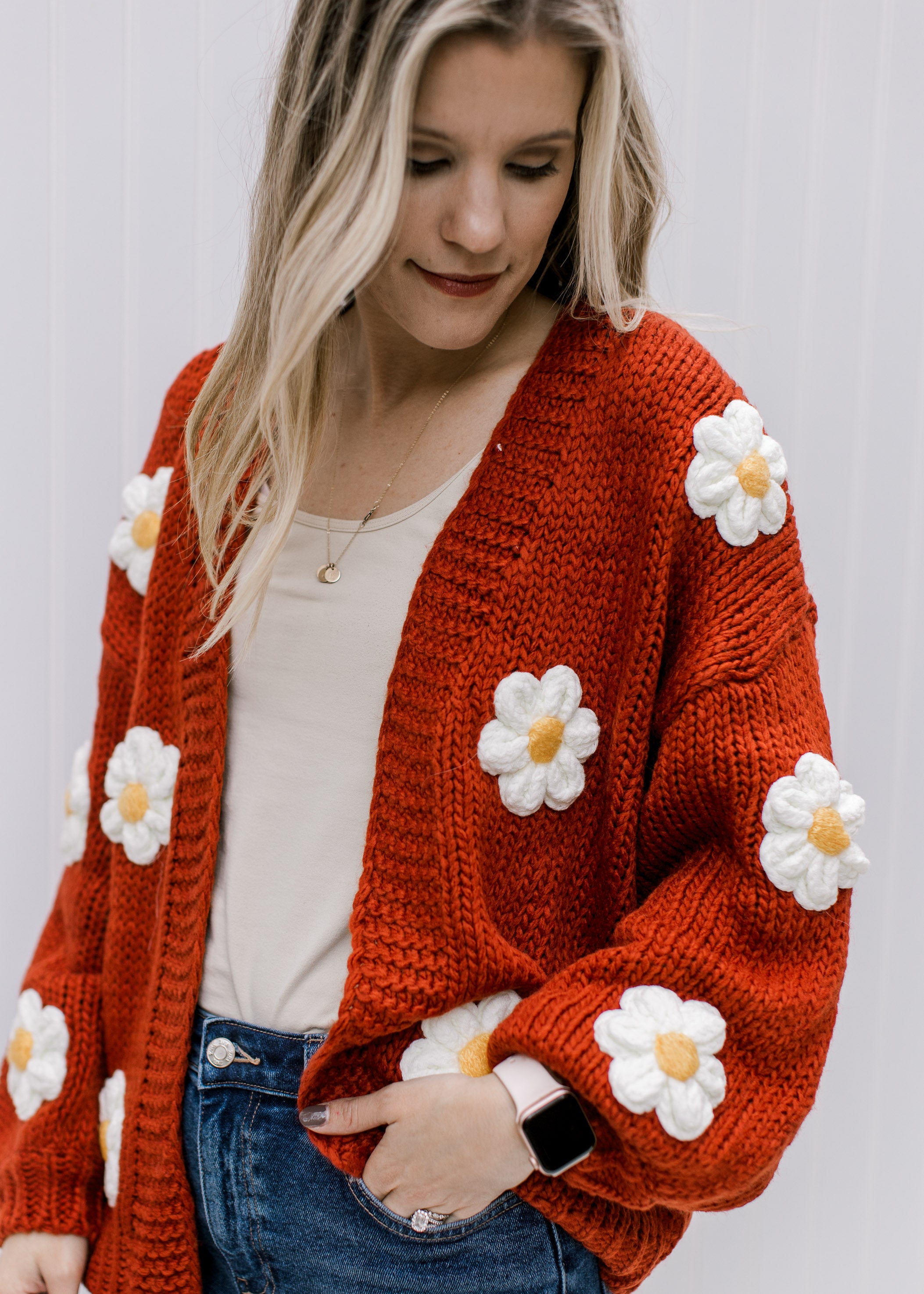 Rust Daisy Cardigan can be rewritten as Stylish Rust-Colored Daisy Patterned Cardigan for better Google SEO results.