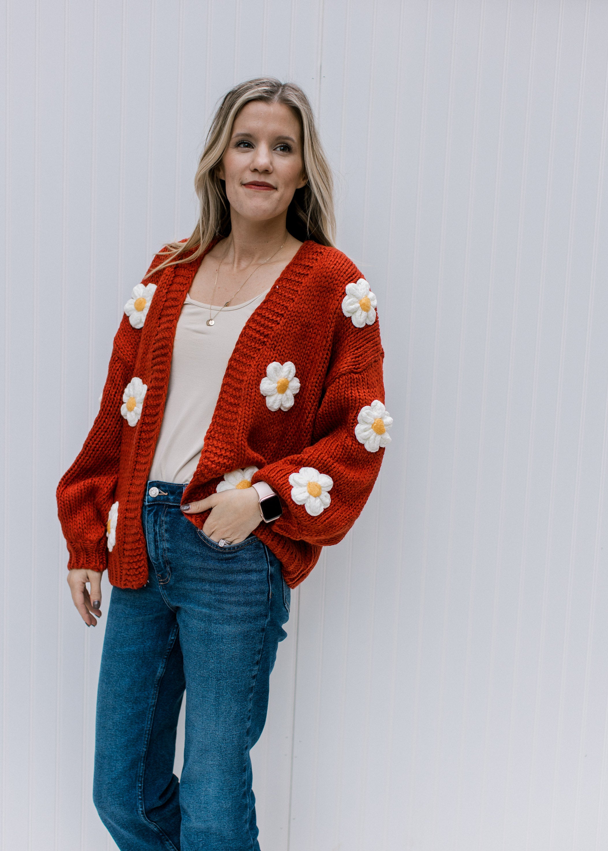 Rust Daisy Cardigan can be rewritten as Stylish Rust-Colored Daisy Patterned Cardigan for better Google SEO results.